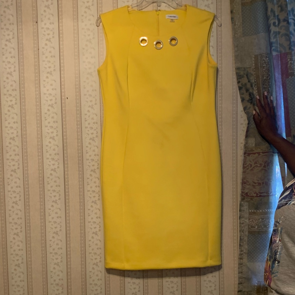Beautiful yellow Calvin Klein dress with gold embellishments. Size 14